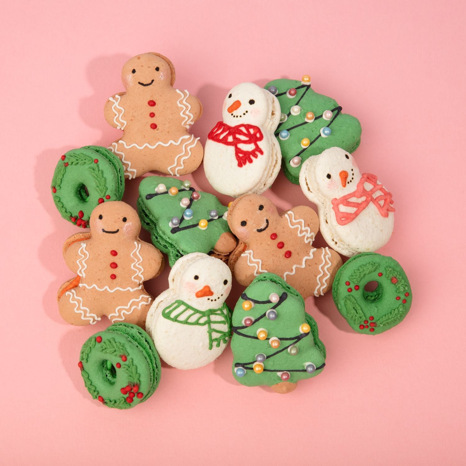 An assortment of Christmas macarons laid out at Oh La La! Macarons