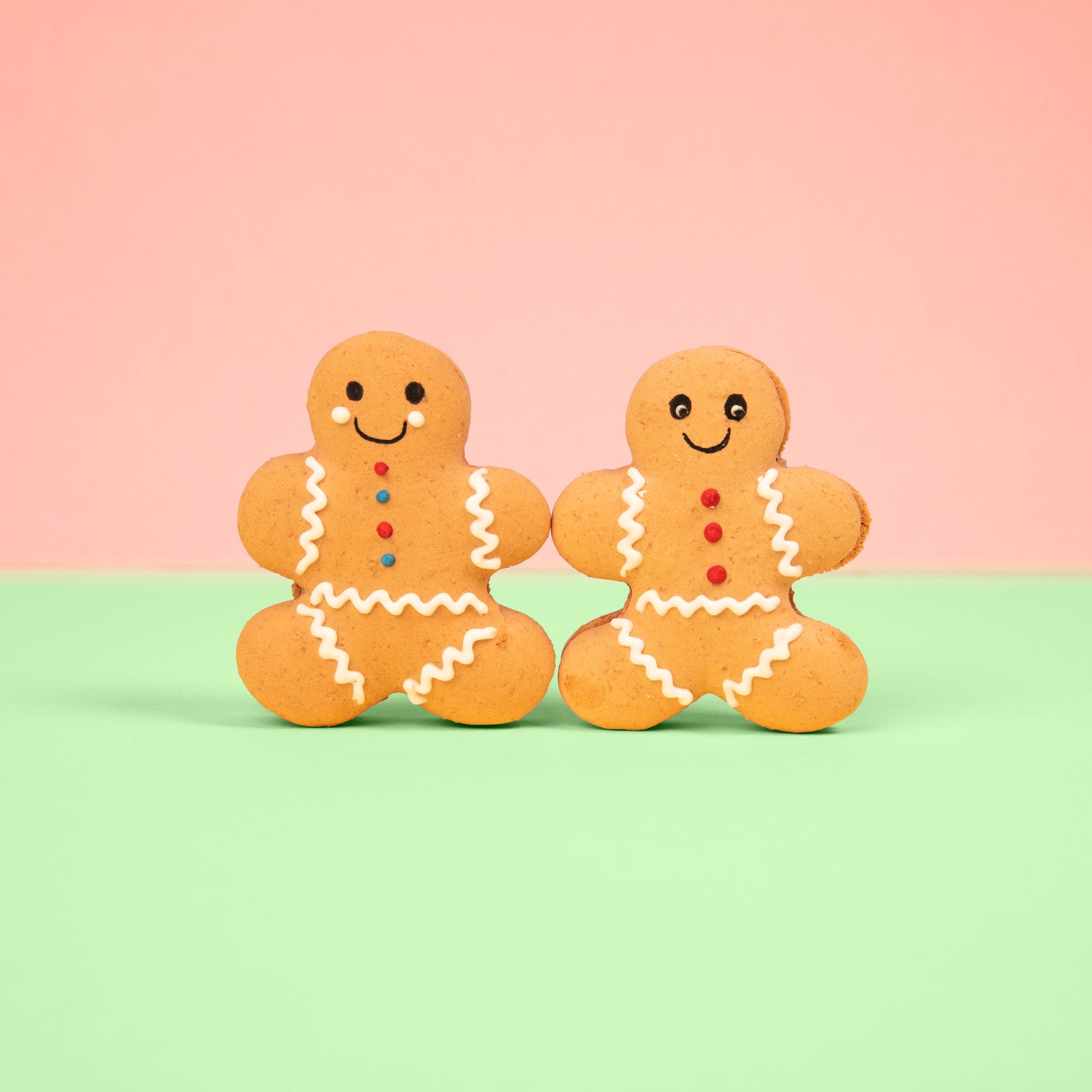 A pair of gingerbread man macarons